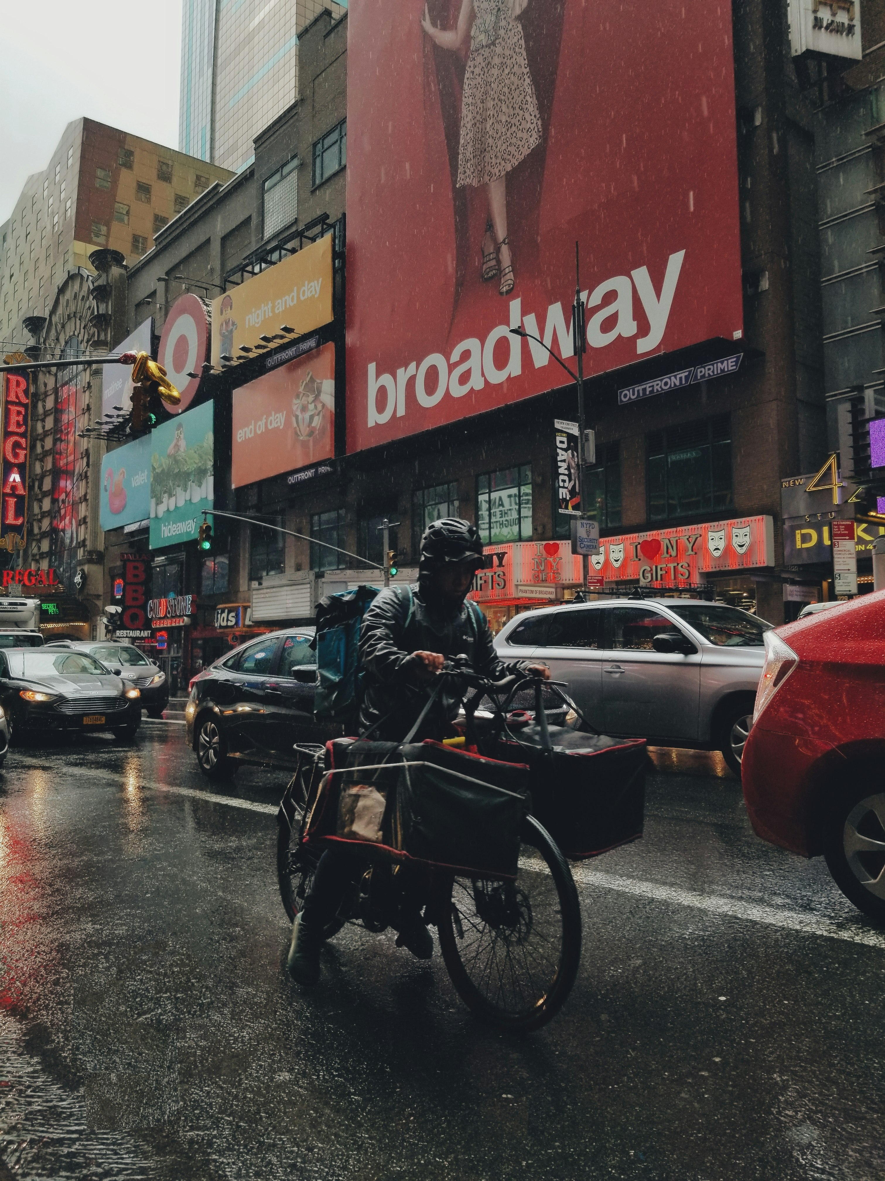 man riding bicycle in road during daytime